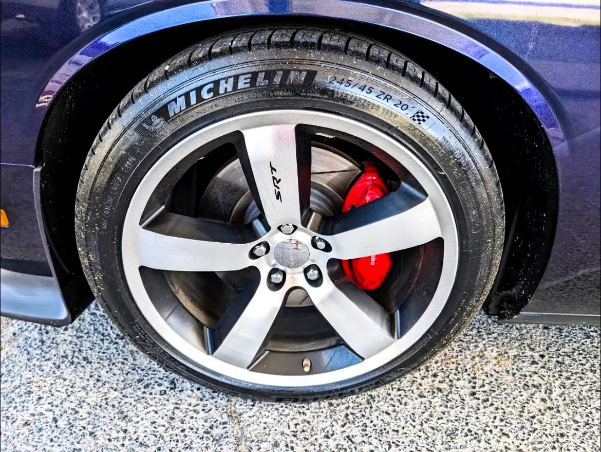 Detailed wheel with red brake caliper after cleaning