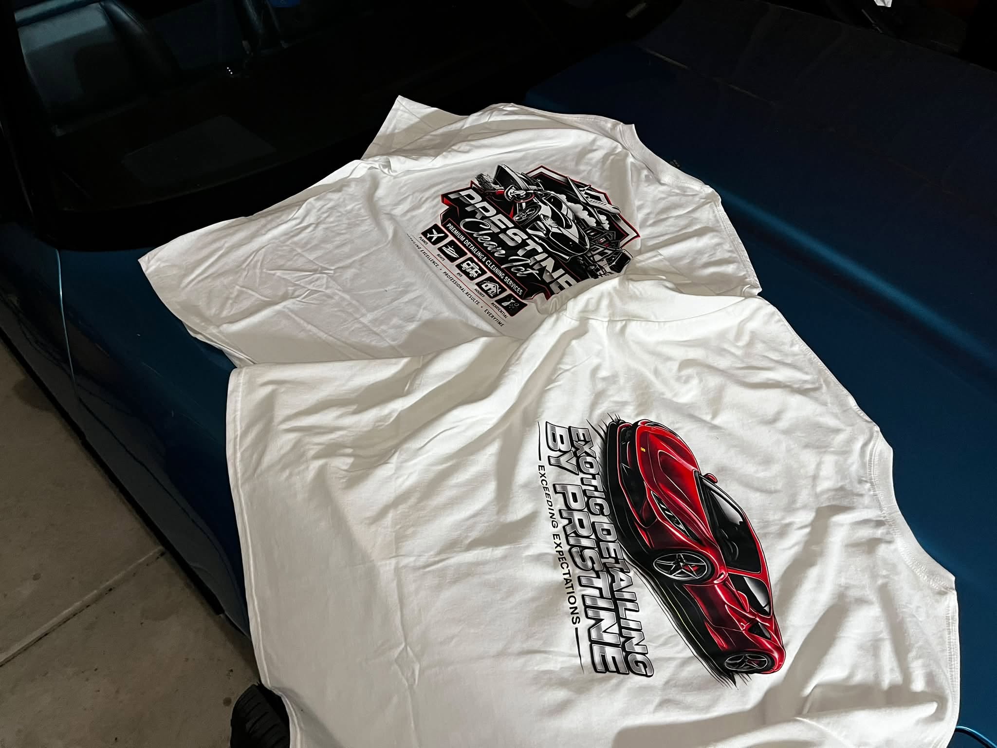 White Prestine Clean ICT T-shirt with a red exotic car graphic
